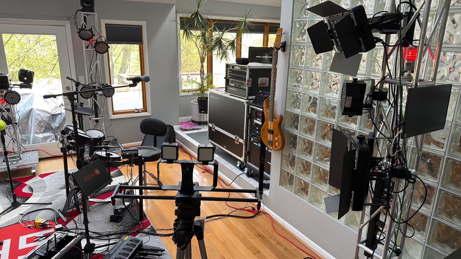 A SodaPop House production setup with instruments, cameras, lighting and recording equipment